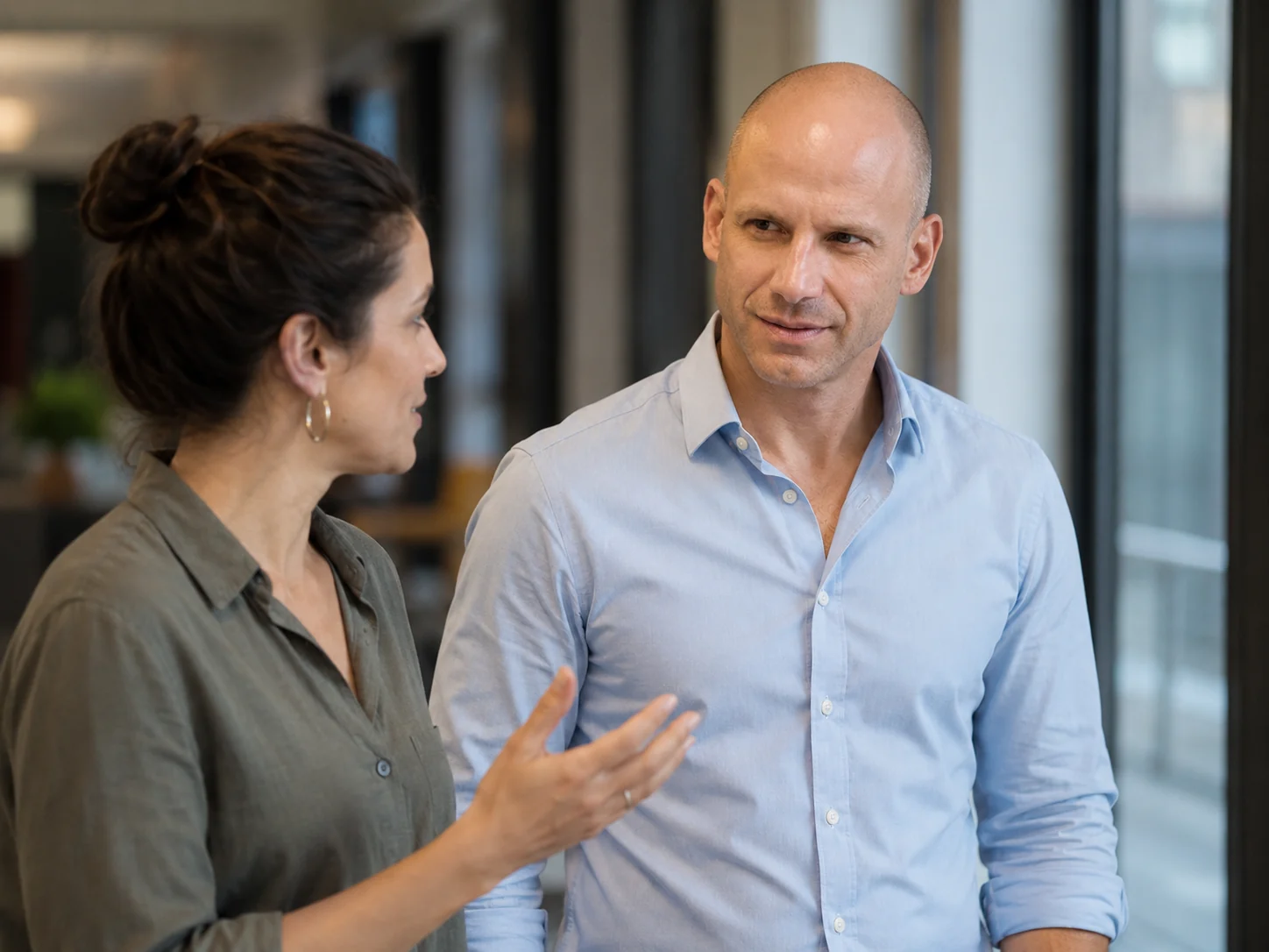 Dov Smith in conversation with a colleague